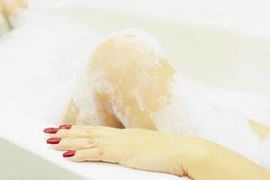 Sexy girl in white bathtub photo