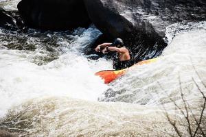 People playing raft adventure sport activity in the river photo