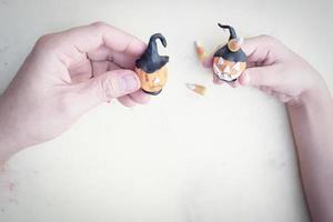 Vintage style photo of father is playing Halloween clay with his son