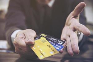 Merchant man's hand using credit card machine photo