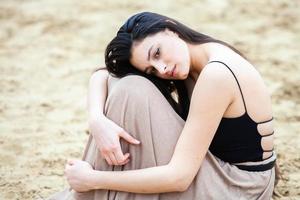 beautiful white european girl with clean skin poses on the street in the city photo