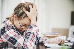 Young frustrated woman working at office photo