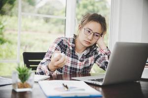 Young frustrated woman working at office photo