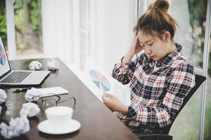 Young frustrated woman working at office photo