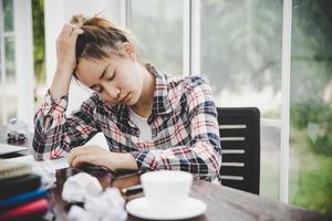 Tired businesswoman working on a computer photo