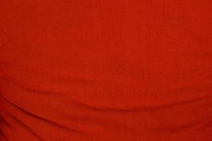 Red wrinkled fabric texture for background photo