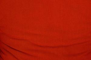 Red wrinkled fabric texture for background photo