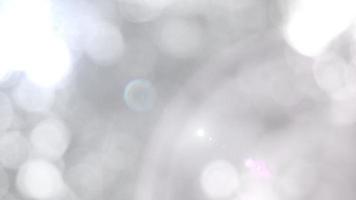 The illuminated white bokeh image can be used as a background illustration or add text. photo