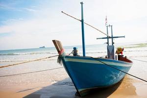 tied up boat on beach photo