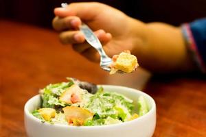 cesar salad in white bowl photo