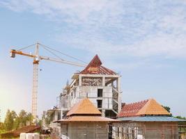 The building under construction overlooking the sky and clouds. photo