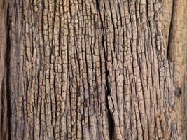 An old wooden plank table with a mottled surface and a pattern. photo
