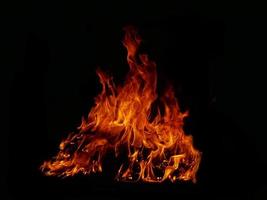 Flame Flame Texture For Strange Shape Fire Background Flame meat that is burned from the stove or from cooking. danger feeling abstract black background Suitable for banners or advertisements. photo