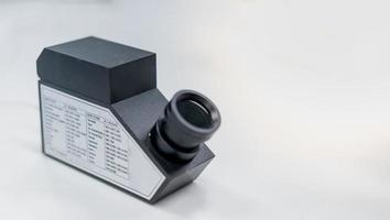 The refractometer for examing the type of precious stone. photo