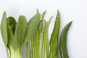 Green Organic Vigetables isolated on white background, for healthy food cooking advertisement design photo