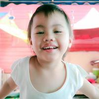 Headshot of charming 3 years old cute baby Asian girl, little toddler child. photo