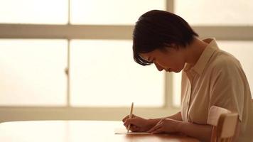 Woman writing a letter video