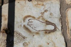 Footprint on Marble for advertisement of the Brothel in Ephesus, Izmir, Turkey photo