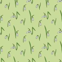 Seamless pattern with amazing snowdrops on light green background for plaid, fabric, textile, clothes, tablecloth and other things. Vector image.