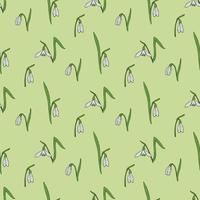 Seamless pattern with amazing snowdrops on light green background for plaid, fabric, textile, clothes, tablecloth and other things. Vector image.