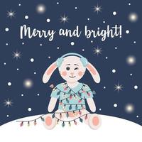 Cute rabbit in winter headphones is wrapped in a garland. Winter card with shining lights and snow. Merry and bright text. vector