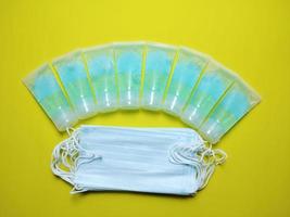 Alcohol gel mask tube blue yellow background, concept, prevention of epidemic covid 19