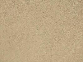 light brown concrete wall background rough texture background and wallpaper photo