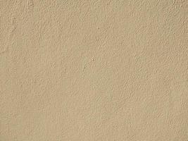 light brown concrete wall background rough texture background and wallpaper photo