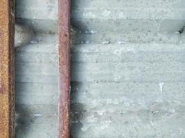 metal roof  A lot of red steel beams are being eaten by rust, giving the concept of deterioration, corrosion. photo