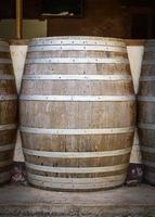 Wine barrels in the cellar of the winery photo