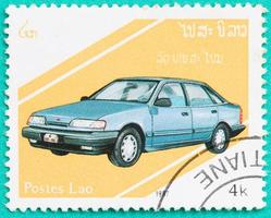 Postage stamps with printed in Laos shows car photo