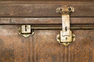 Lock of an old metal casket close up photo