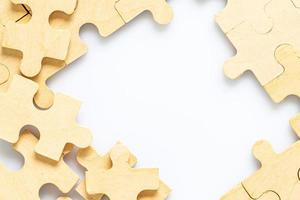 wooden jigsaw puzzle pieces on white background photo