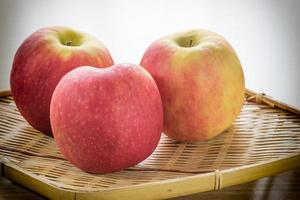 Red apple in basket photo