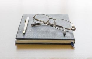 Black book with glasses photo