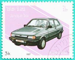 Postage stamps with printed in Laos shows car photo