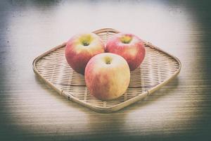 Red apple in basket photo