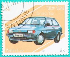 Postage stamps with printed in Laos shows car photo