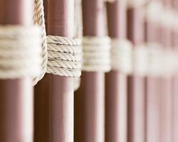 Rope knot around a metal fence photo