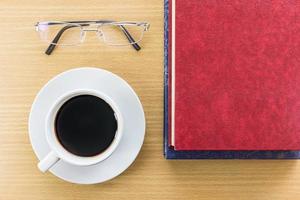 Coffee on a wood table with glasses photo