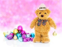 Teddy bear with gifts and ornaments new years photo