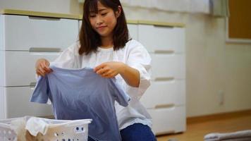 Woman folding laundry video