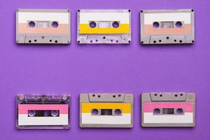 Collection of cassette tapes on purple background. photo