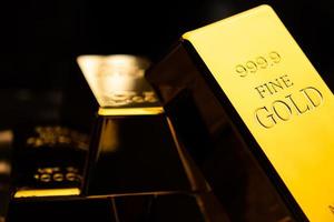 Close up of gold bars on black bacground. financial concept photo