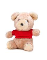 Teddy bear doll with red shirt on a white background photo