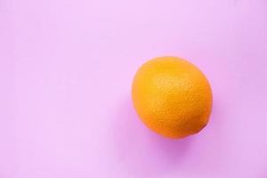 Orange fruit background for pattern top view copy space Fresh orange on pink photo