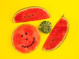 Fresh ripe watermelon slices on yellow background. photo