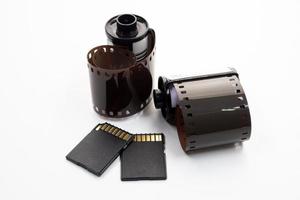 Film rolls and digital memory cards on a white background. photo