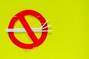 The symbol of stop using unfriendly environmental packages that made from plastic bag and straw. photo
