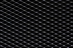 Dark gray and silver grid of metal fence that taking as background. photo